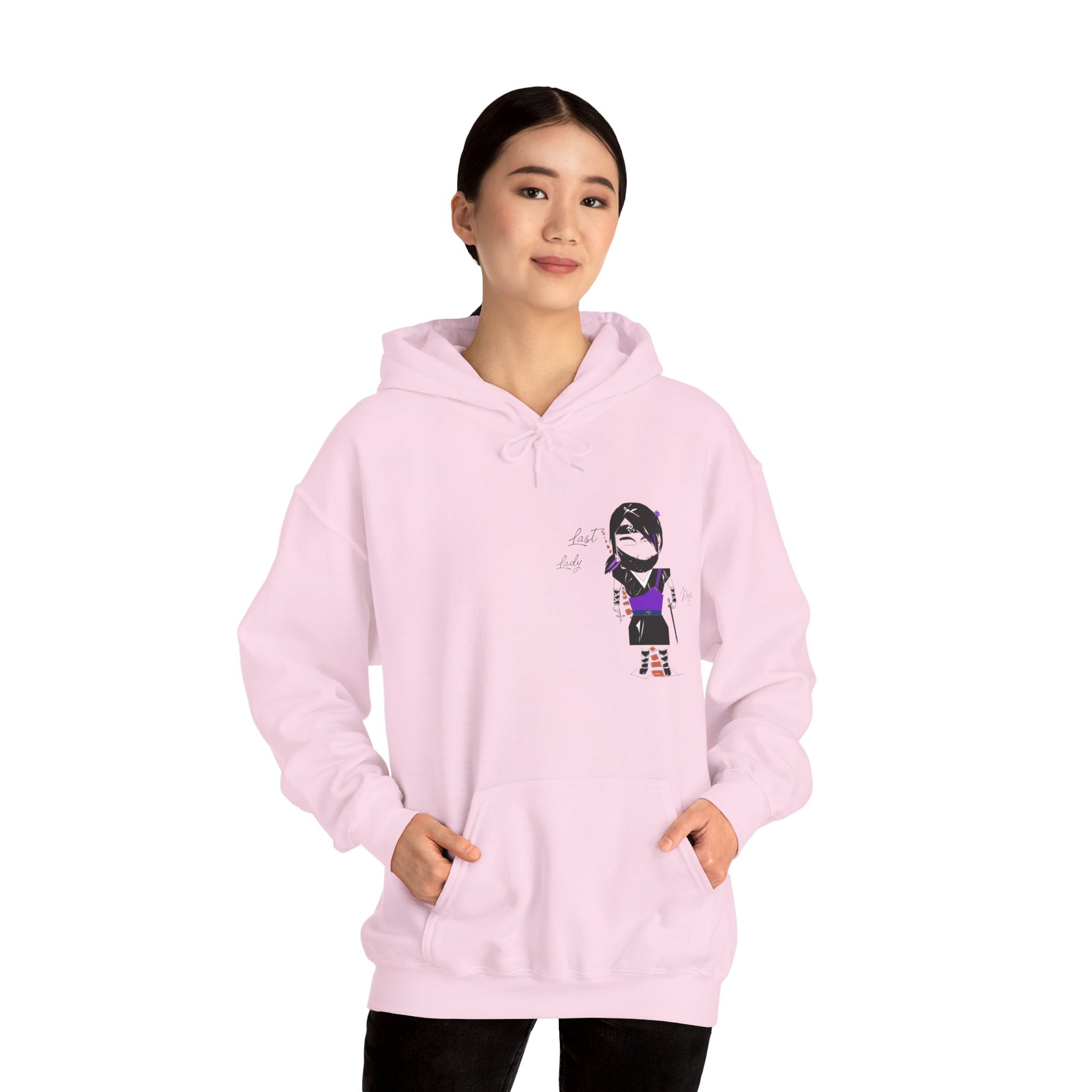 Front view of a lady model wearing a pink hoodie with a lady ninja graphic design on a white background