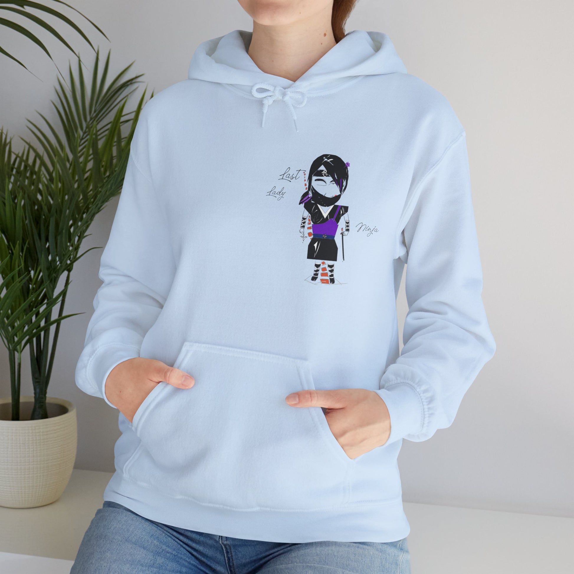 Light blue hoodie with a lady ninja graphic design on a neutral background