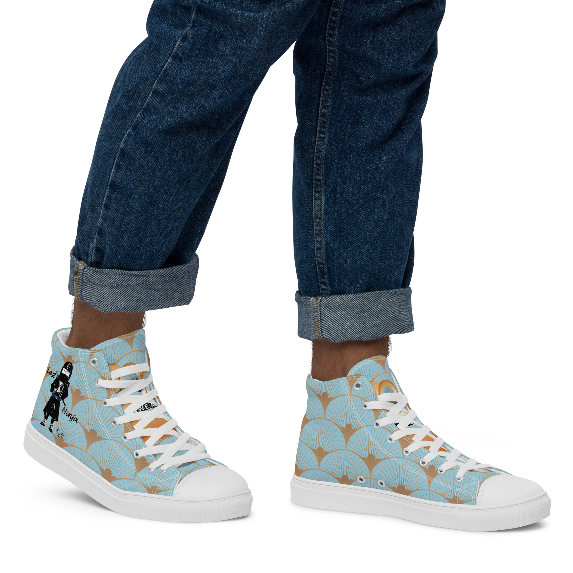 High-top sneakers with a playful ninja graphic design and a fish scale pattern worn with rolled-up jeans on a white background