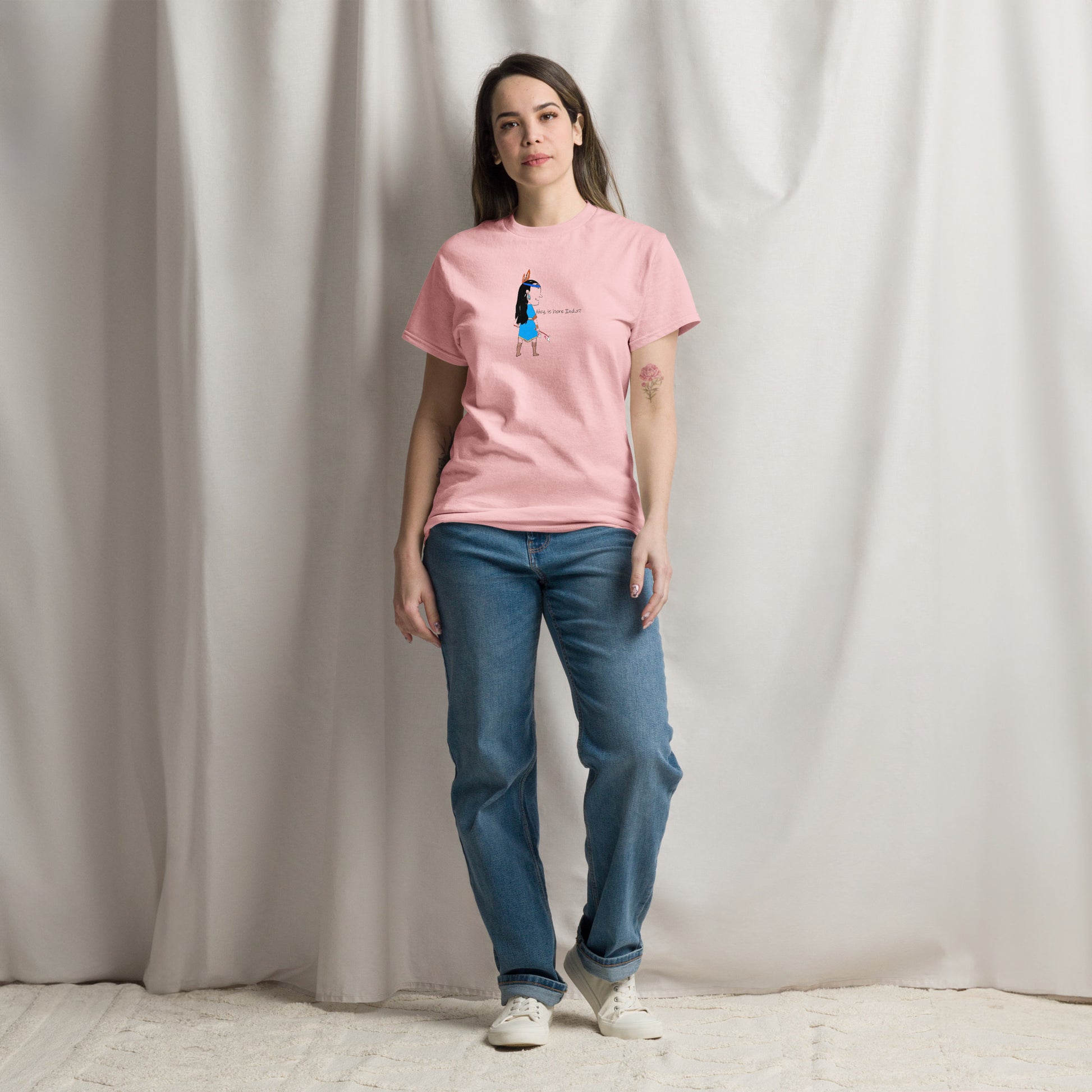 Front view of a lady model wearing a pink t-shirt with an American Indian woman graphic design on a beige background