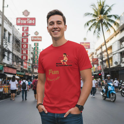 A man wearing a red Thai boxer design tee stands on the street of Pattaya
