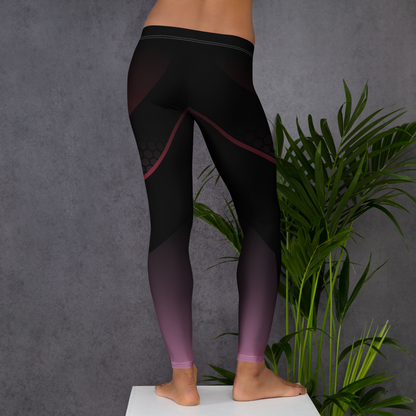 Person wearing black leggings with pink accents against a gray background