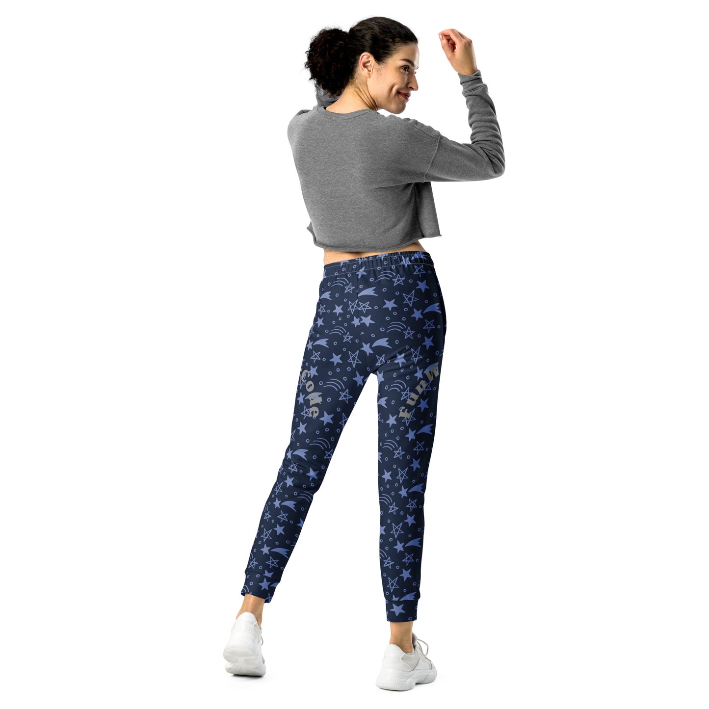 Woman wearing blue patterned joggers with 'Fun Wear Code' text logo and gray crop top on a white background