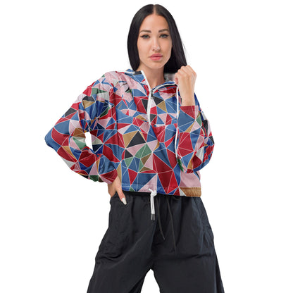 Woman wearing a colorful geometric-patterned jacket with spring cherry blossom graphic on a white background