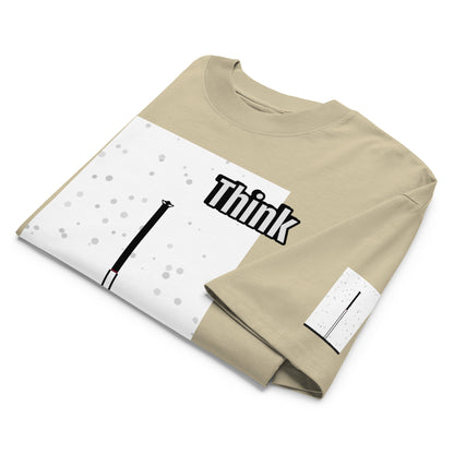 Folded beige t-shirt with 'Think' text and an abstract long-leg human graphic design on a white background