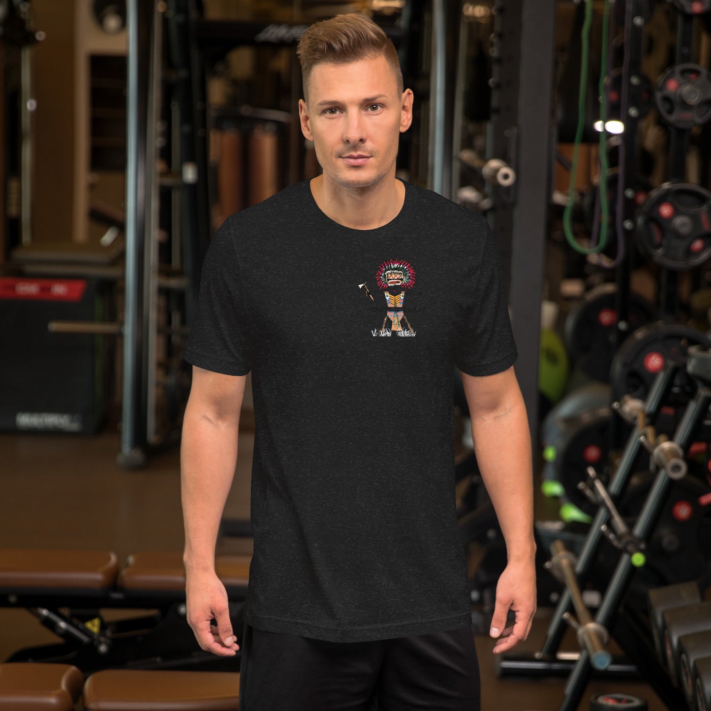 Front view of a man model wearing a black t-shirt with an American Indian man graphic design on a GYM setting background